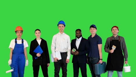 people, profession, qualification, employment and success concept on a green screen, chroma key