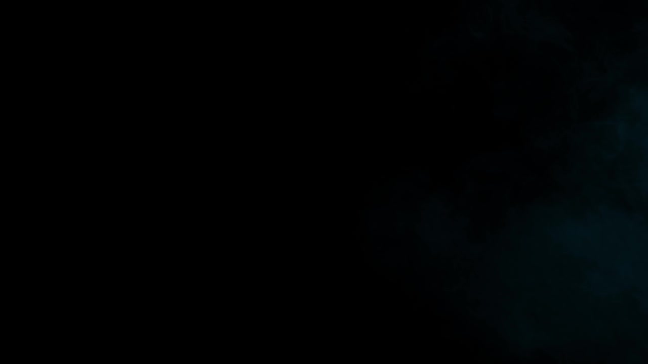Faint cyan light on dark background, perfect for adding subtle atmospheric texture to videos