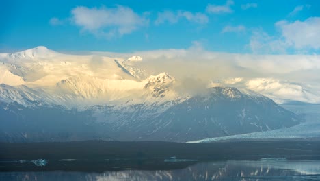 time lapse of snowy mountains and clouds.