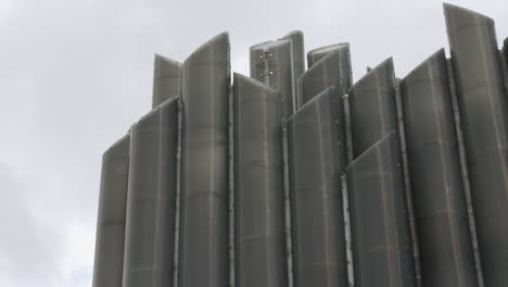 grey metal structure with vertical pipes
