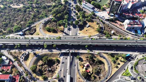 southern mexico city's periferico and insurgentes cloverleaf seen from above