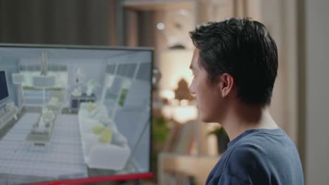 persona mirando un diseño de casa en una computadora