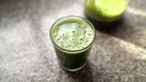 glass of homemade green vegetable juice for detox