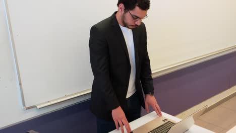 academic professional with materials in classroom