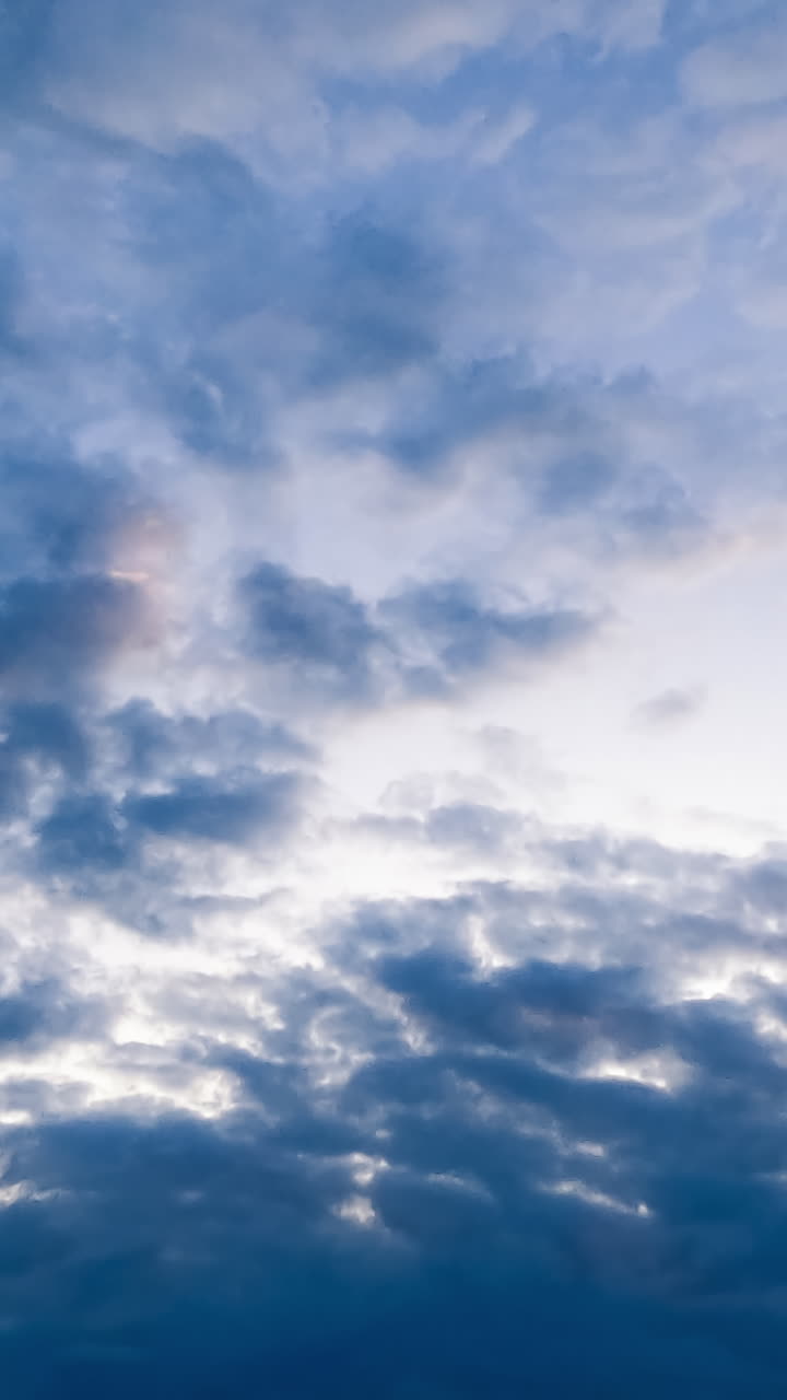 Summer blue sky with clouds timelapse. Flowing sunlight scenery sky. Vertical video
