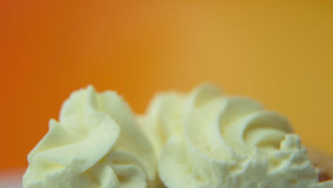 [camera used: canon c300] macro shot, pan down, pumpkin pie slice loaded with fluffy whipped cream