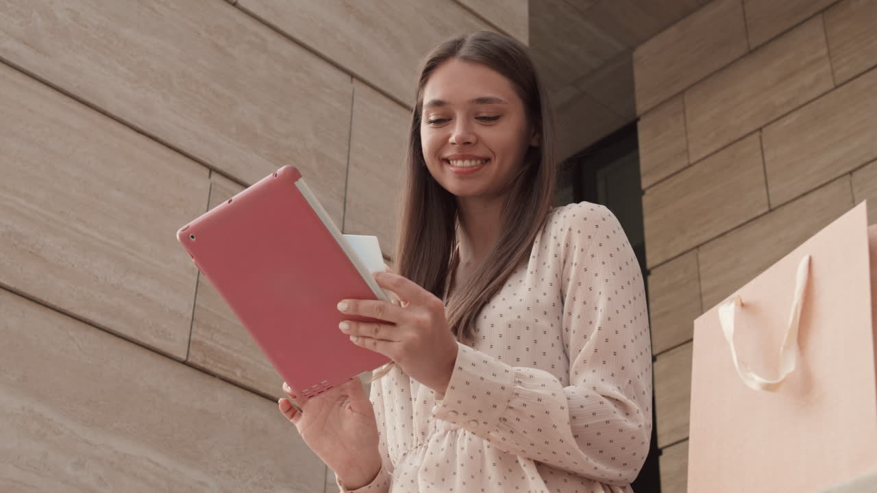 Woman Paying with Credit Card Online