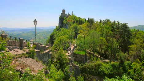 Shot-of-stone-stairways-leading-upto-Cesta-tower-along-the-Guaita-fortress-in-San-Marino,-Italy