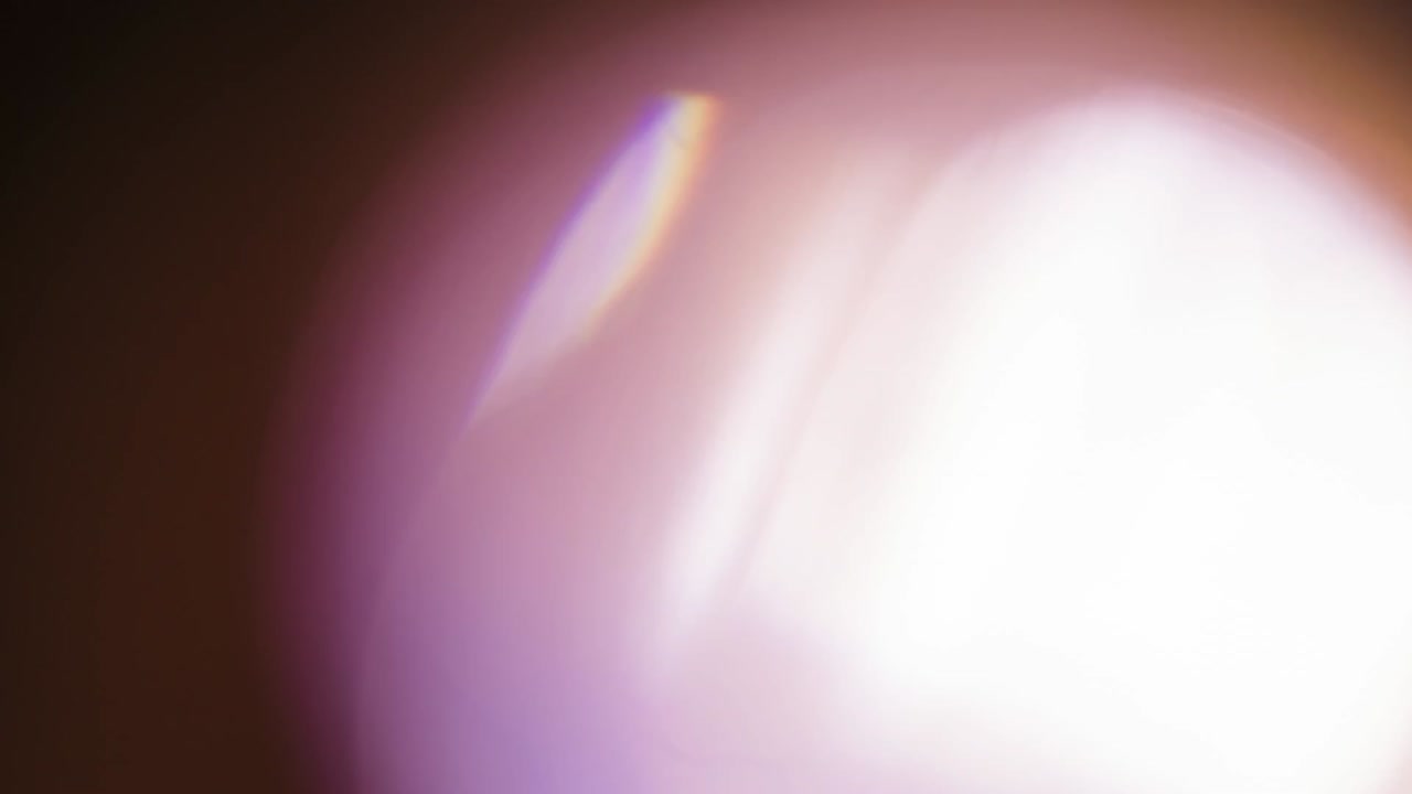 Abstract images featuring various light effects, including lens flares, light leaks, and geometric light projections with colorful glows on dark backgrounds