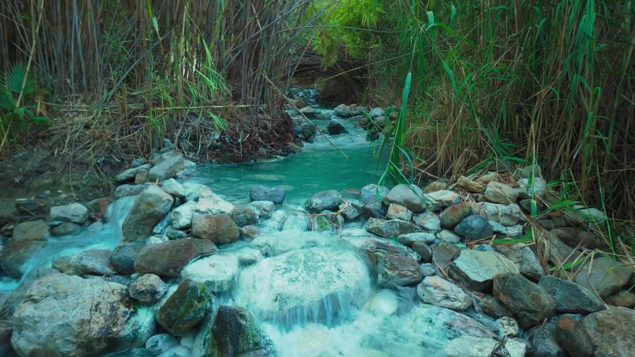 Water flowing at Hedionda de Casares, Andalusia, Spain, tilting up to reveal the natural sulfuric river