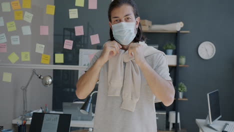 man in office wearing mask