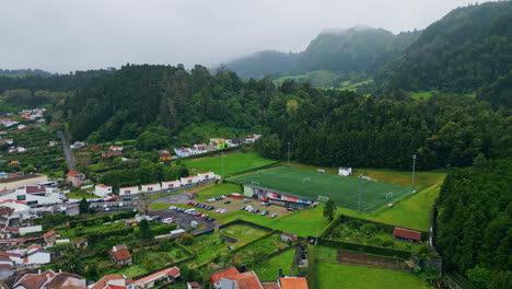 drone countryside slopes rainy weather nature. small houses at valley landscape