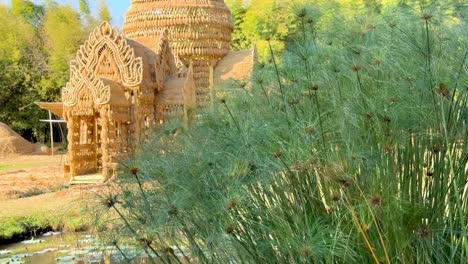 serene temple surrounded by lush greenery and water