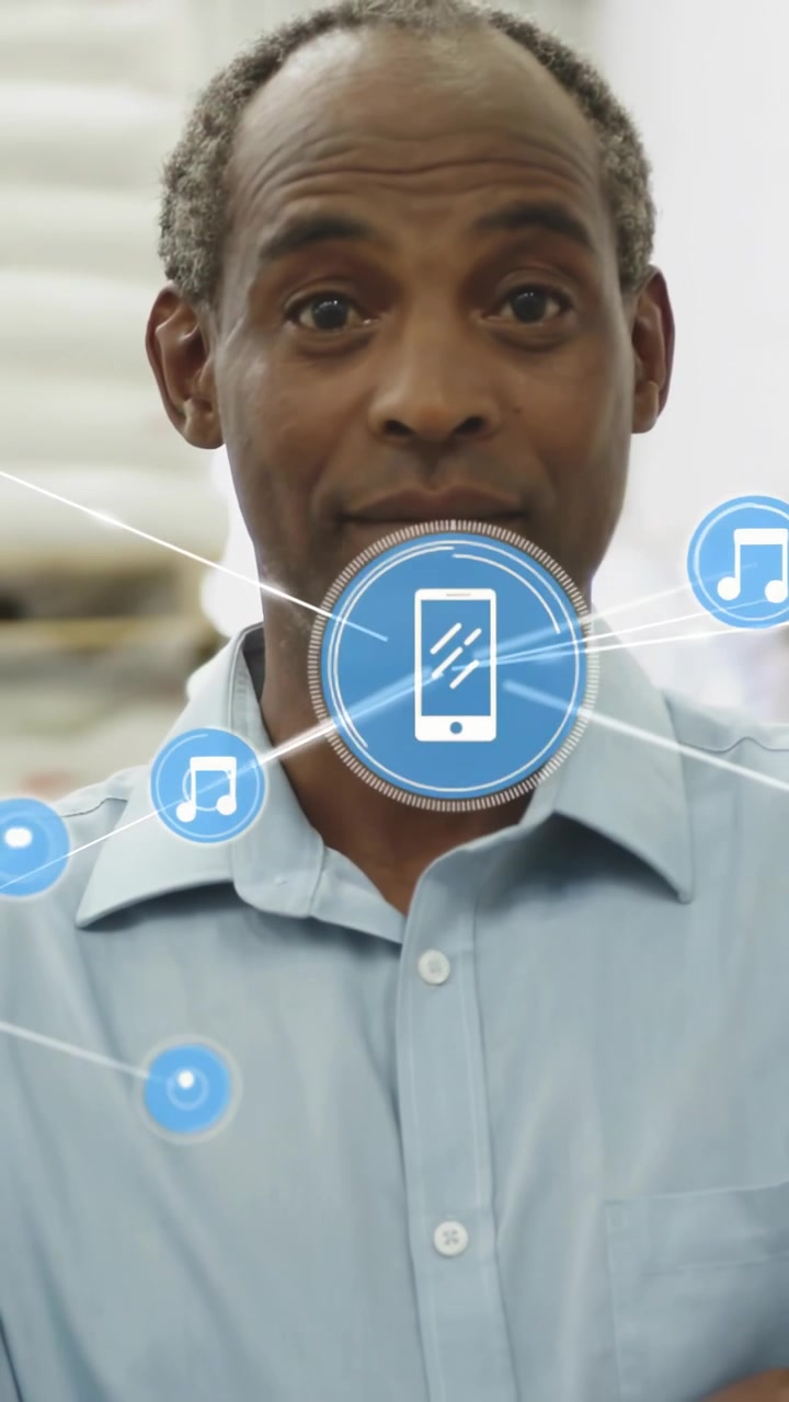 Vertical video: Man uncrossing, moving hand in office starting phone icon tech demo around chest