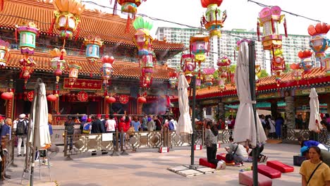 colorful lanterns and visitors at hong kong temple