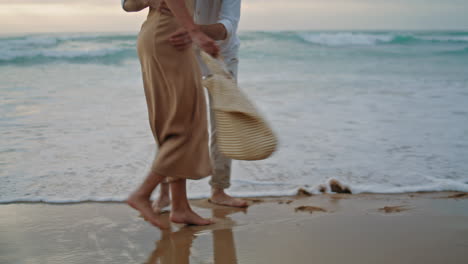 people feet walking sand beach at vacation. unrecognizable couple stepping shore