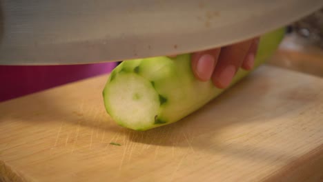 a cucumber sliced on a cutting board