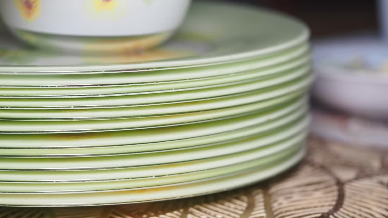 Stacked Green Plates with Floral Design