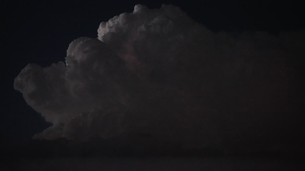Beauty in nature revealed as lightning flashes across a dramatic sky at dusk
