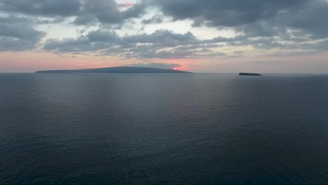 sunset over kahoolawe with alalakeiki shot from big beach maui, aerial view