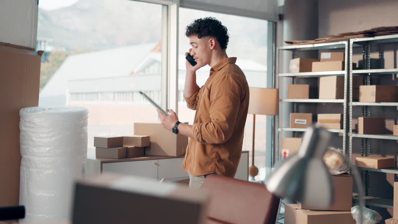 Man taking a phone call while managing inventory in a warehouse