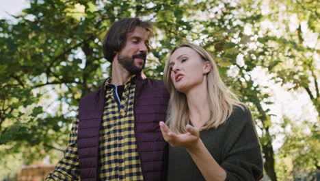 Low-angle-view-of-affectionate-couple-during-autumn-walk