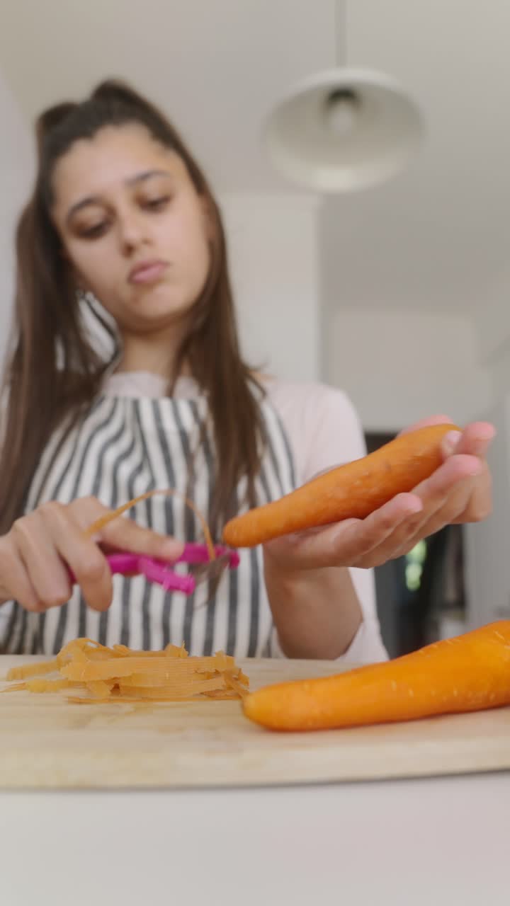 Teenage Girl Peeling Carrots