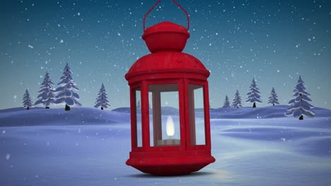 Red-christmas-lamp-against-snow-falling-over-multiple-trees-on-winter-landscape