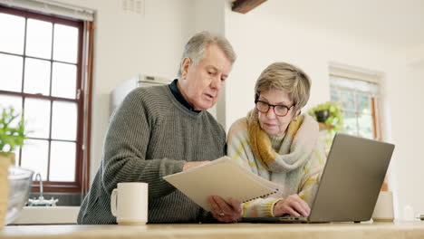 Senior-couple,-documents-and-laptop-in-home