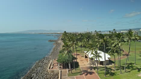 aerial view of hawaiian waterfront tracking forward on sunny day