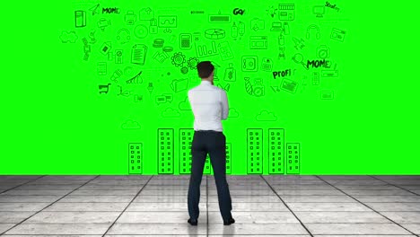 businessman looking at green interface