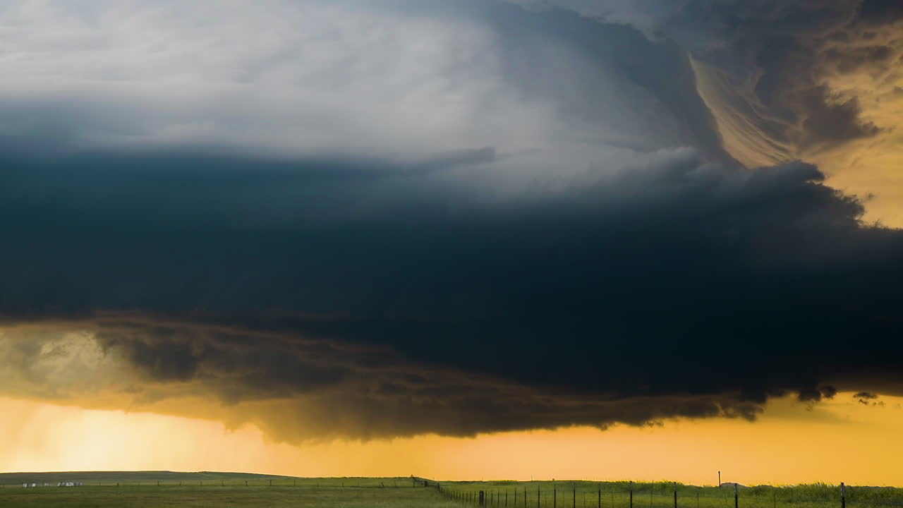 Supercell Thunderstorm Over Plains at Sunset
