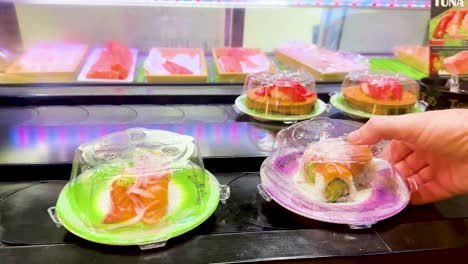 sushi plates moving on a conveyor belt