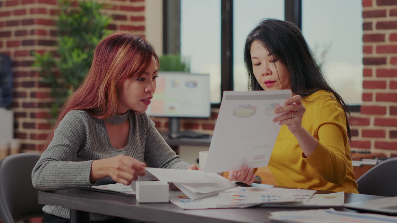 Business partners working with e commerce statistics