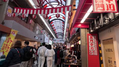 crowded shopping arcade with vibrant activity