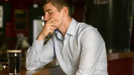 Stressed-man-sitting-at-the-bar