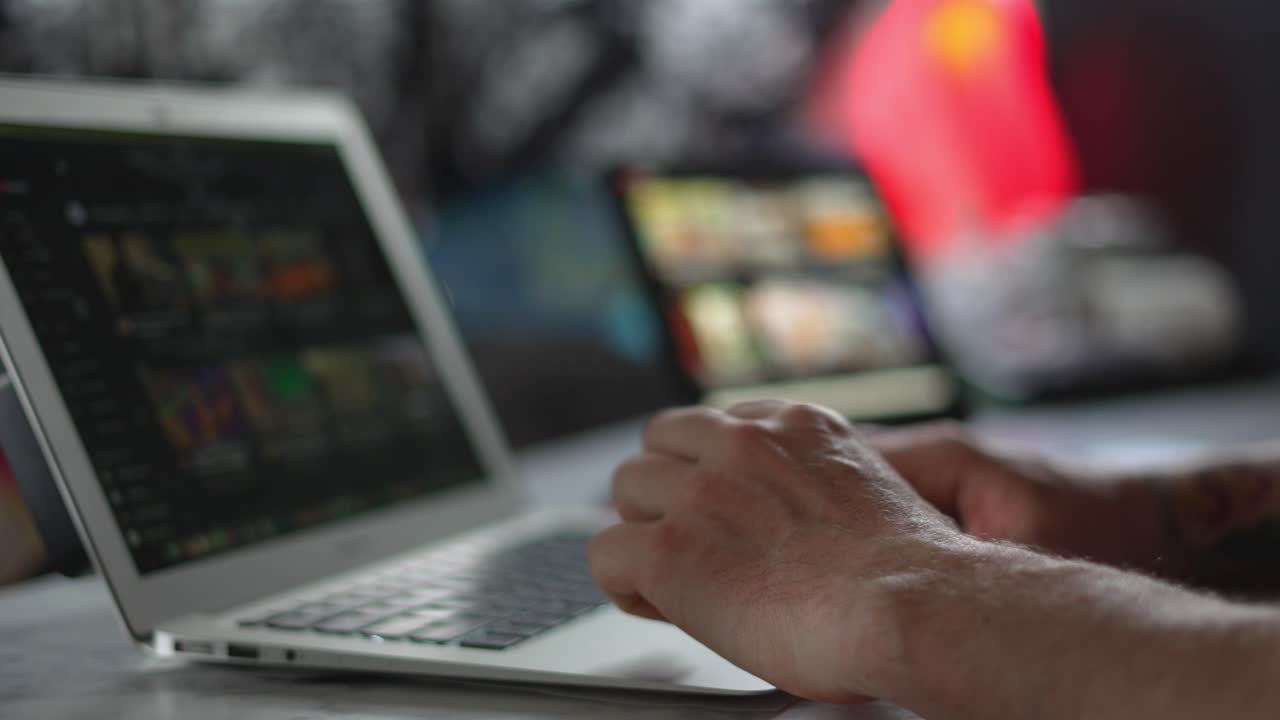 Man Typing on Laptop Computer