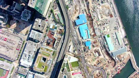 hong kong downtown kowloon urban area, top down aerial view with traffic and city skyscrapers