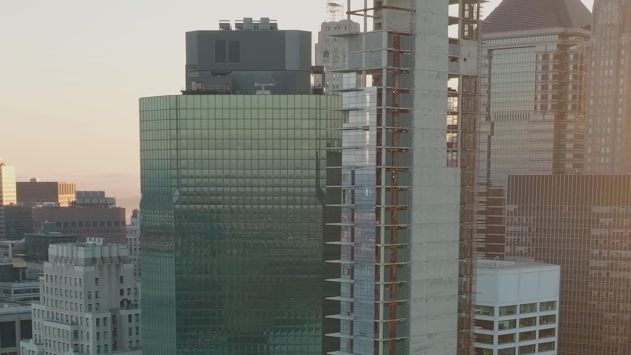 Cityscape at Sunset with Skyscrapers and Construction