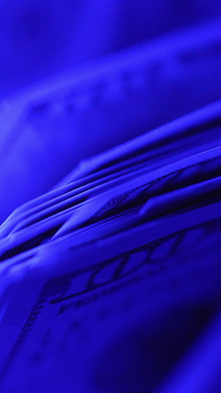Close up of counting money in special machine. Currency financial banknote counter. Vertical video