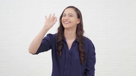 indian girl showing okay sign