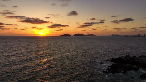 Aerial-tracking-shot-of-serene-sunset-on-the-coast-of-Mazatlan,-Sinaloa,-Mexico