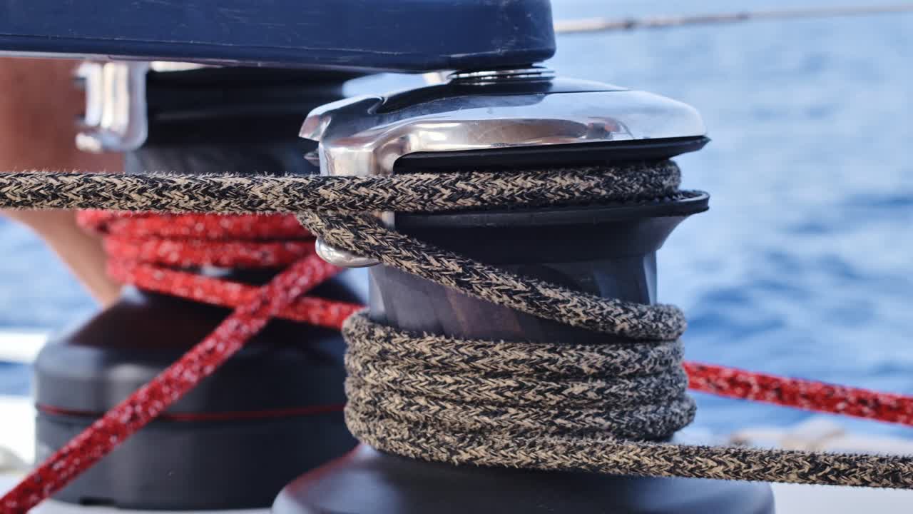 Detailed view of sailing ropes around winch showing nautical precision, 4K