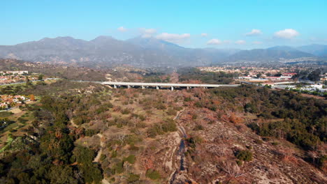 aerial fly into bridge with a mountain background