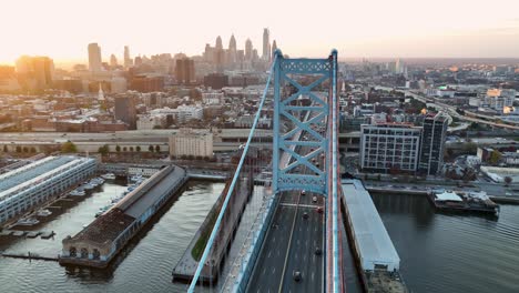 aerial turn reveals philadelphia skyline from ben franklin bridge