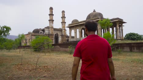 Man-exploring-Kevada-Mosque-is-a-mosque-in-Champaner,-Gujarat-state