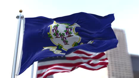 The flags of the Connecticut state and United States of America waving in the wind. Democracy and independence