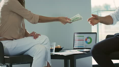 close up view of hands counting money in luxury house