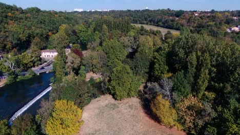 drone flying straight over a park, looking in the distance