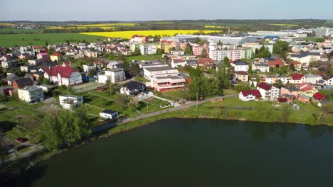 beautiful summer in the european village - green field view on the background of country houses